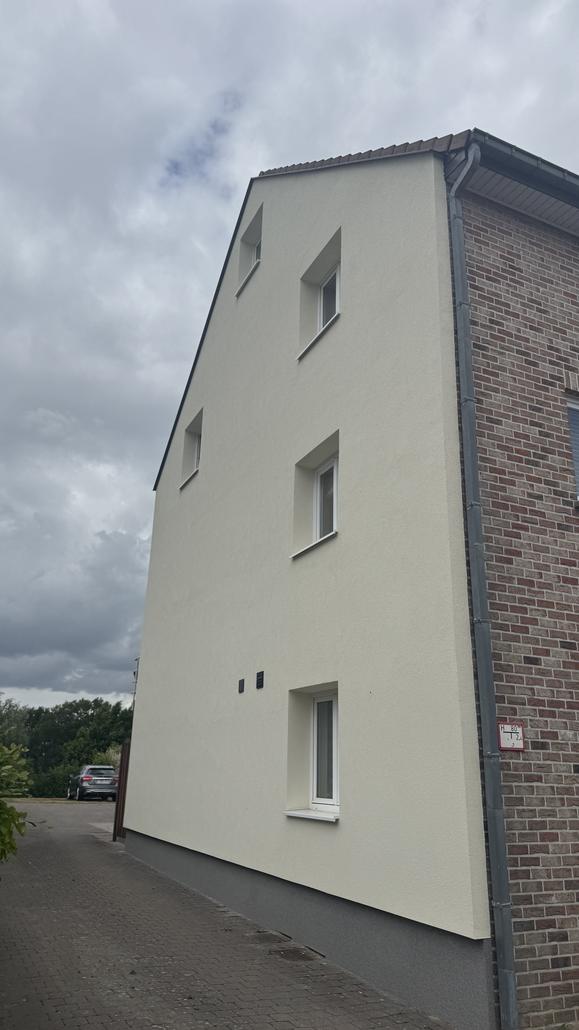 Façade en crepi gris à Zaventem