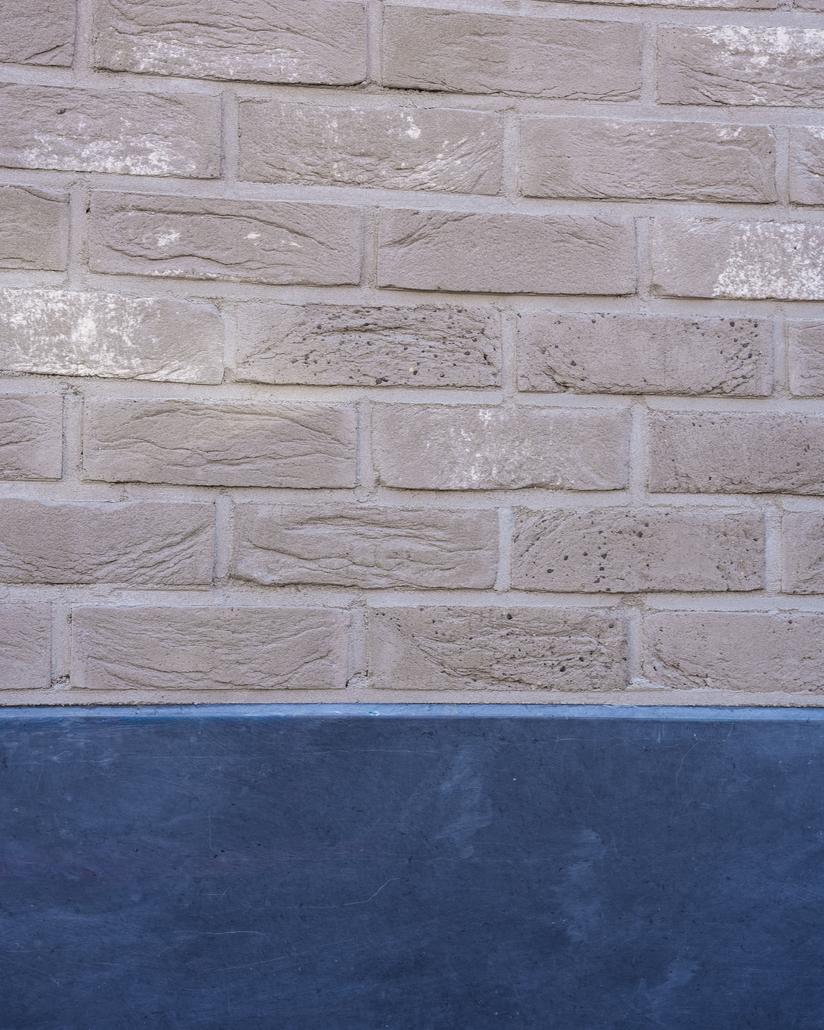 Gevel met isolatie en steenstrips Merksem