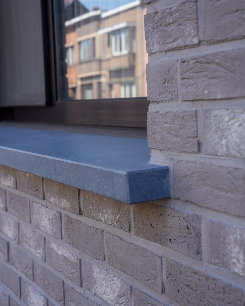 Gevel met isolatie en steenstrips Merksem