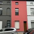 Isolation de façade et crepi rose à Gand