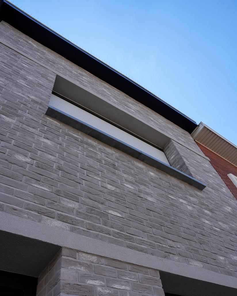 Gevel met isolatie en steenstrips Merksem