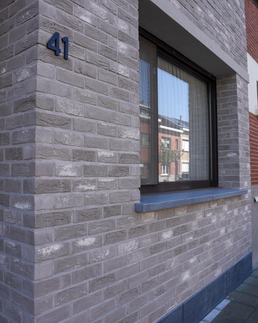 Gevel met isolatie en steenstrips Merksem