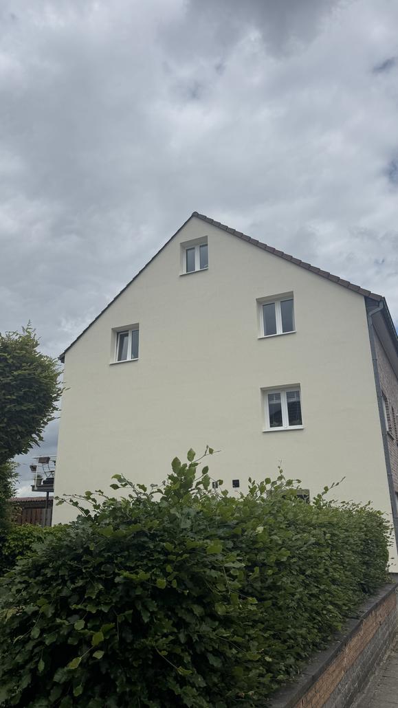 Façade en crepi gris à Zaventem