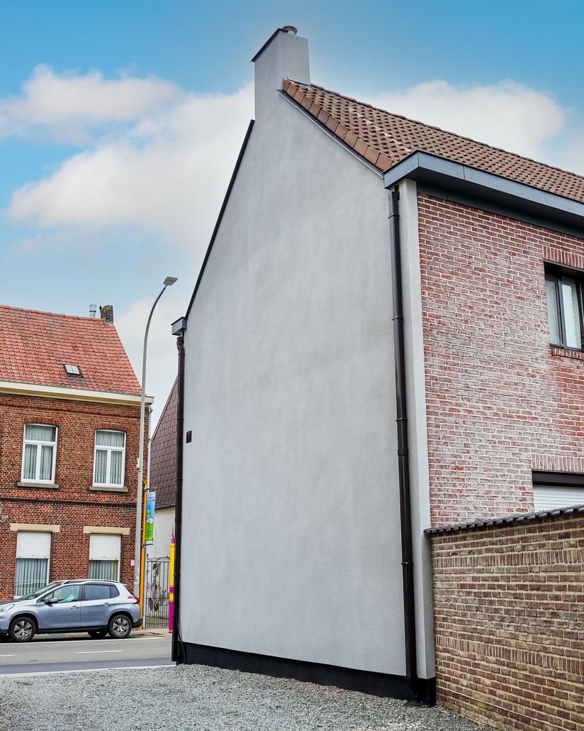 Gevelrenovatie met spuitkurk in Berlare