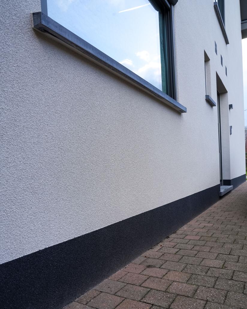 Gevelrenovatie met spuitkurk in Sint-Gillis