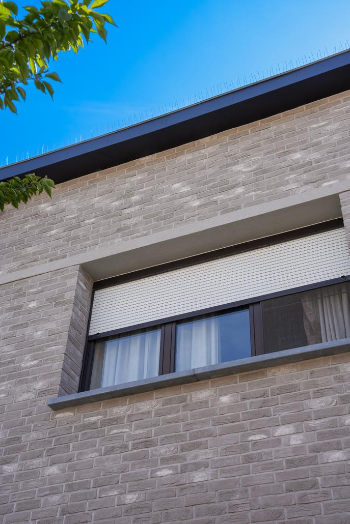 Gevel met isolatie en steenstrips Merksem