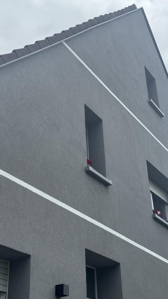 Façade en crepi gris à Zaventem