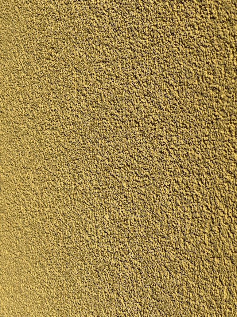 Façade en crepi jaune à Saint-Nicolas