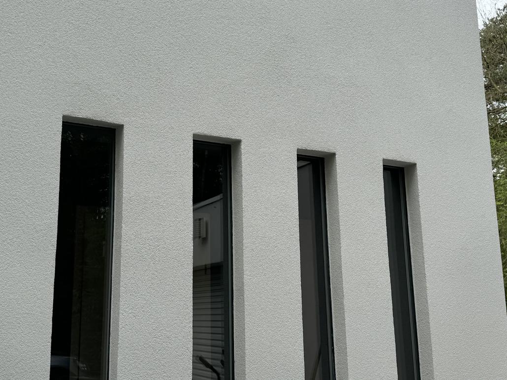 Façade blanche en crepi pour une maison à Poppel