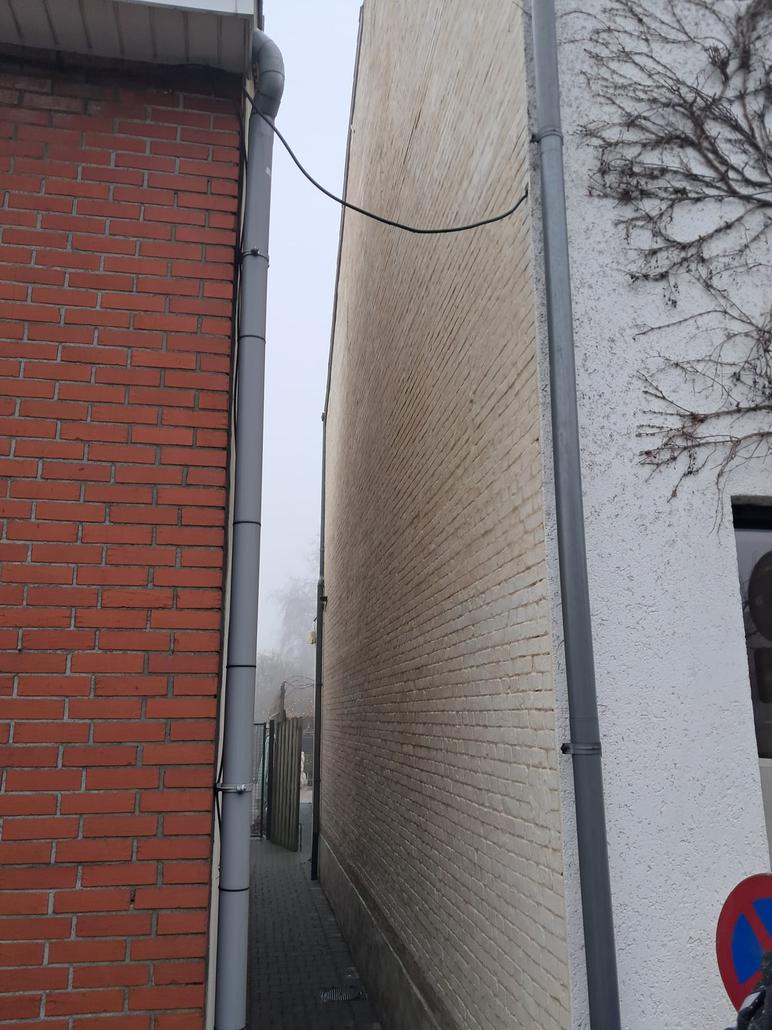 Gevelisolatie en crepi met houtafwerking in Kapellen