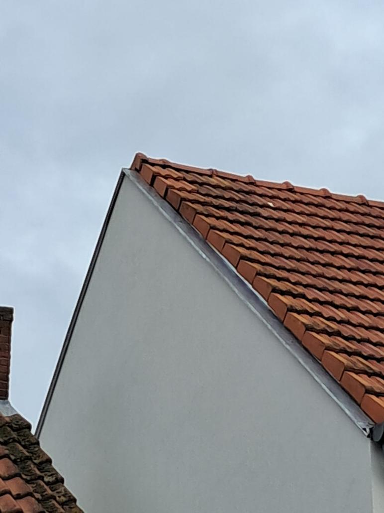 Gevelisolatie en crepi met houtafwerking in Kapellen