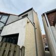 Gevelisolatie en crepi met houtafwerking in Kapellen