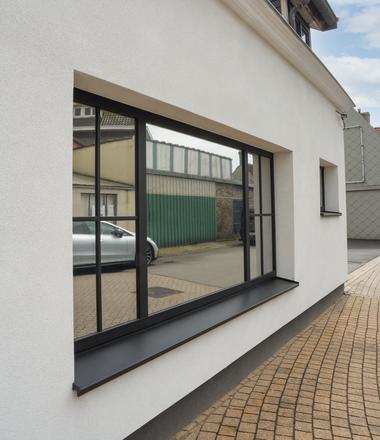 Spuitkurk gevelrenovatie Klemskerke Gevelisolatie met spuitkurk in Klemskerke en zinken afvoer