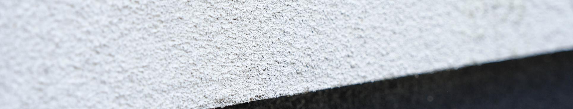 Rénovation de façade avec finition en liège projeté à Sinaai-Waas