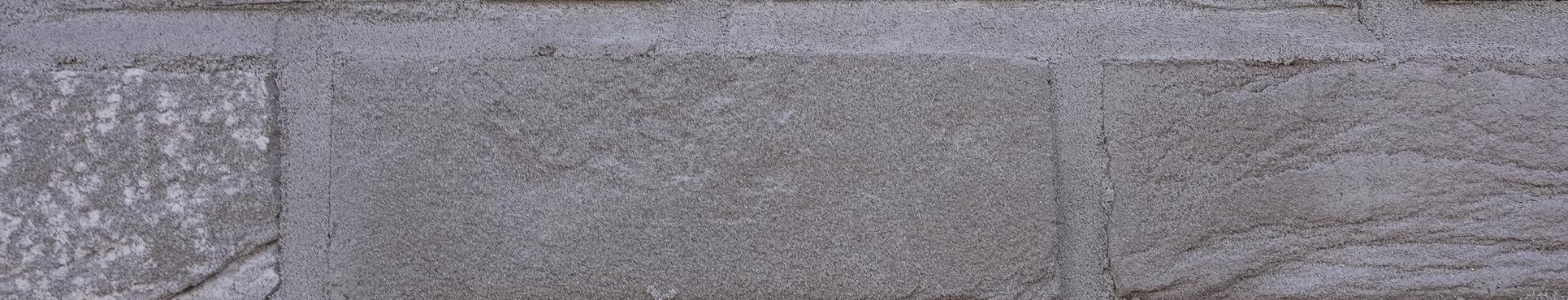 Gevelisolatie met afwerking in steenstrips te Merksem