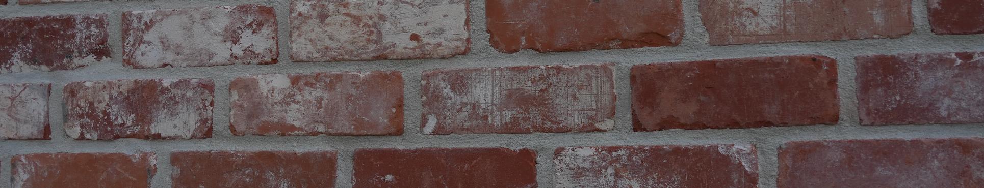 Gevelisolatie met afwerking in steenstrips