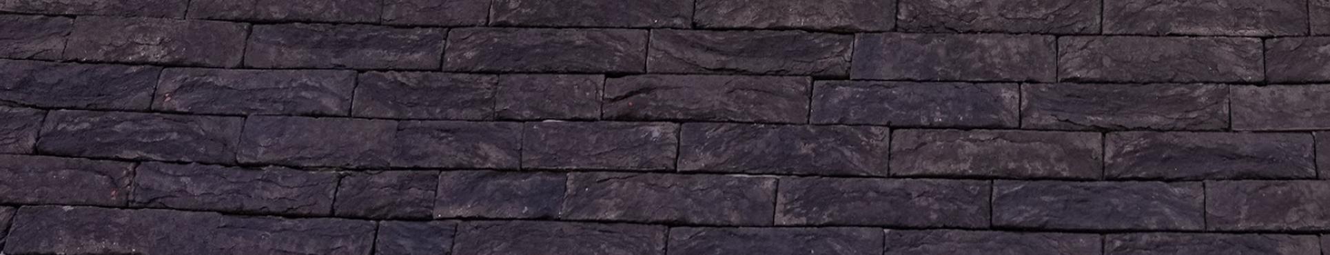 Gevelisolatie met afwerking in spuitkurk en steenstrips te Hofstade